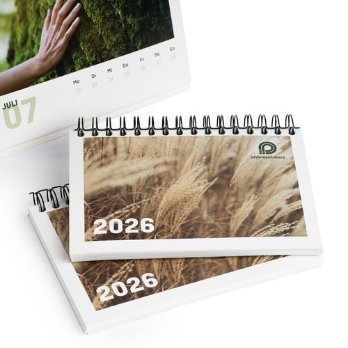 Paper table calendar with spiral binding.