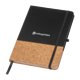 Black notebook with cork accent, elastic band, and ribbon bookmark.