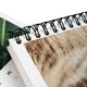 Paper weekly calendar with spiral binding.