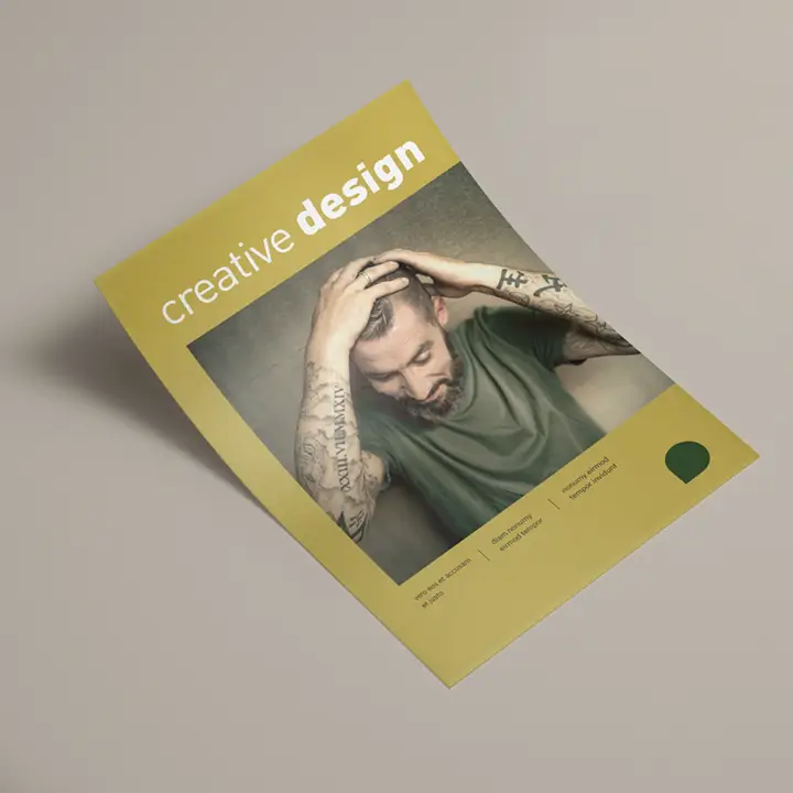 Image Portrait flyer in mustard yellow with a photo of a tattooed man and the words ‘creative design’