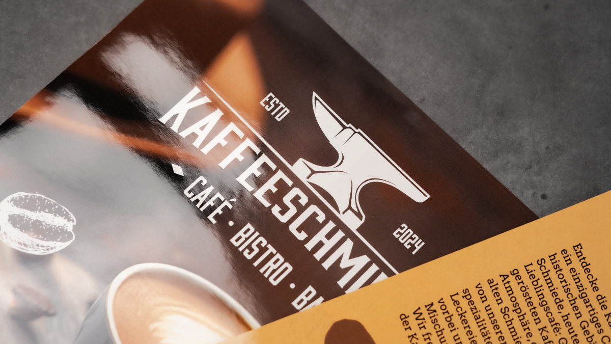 Image Caf� flyer with a glossy varnished surface reflecting the light