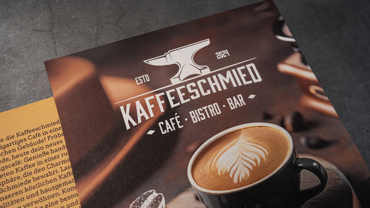 Image Caf� flyer with a cappuccino motif on matt recycled paper, next to a sheet of text